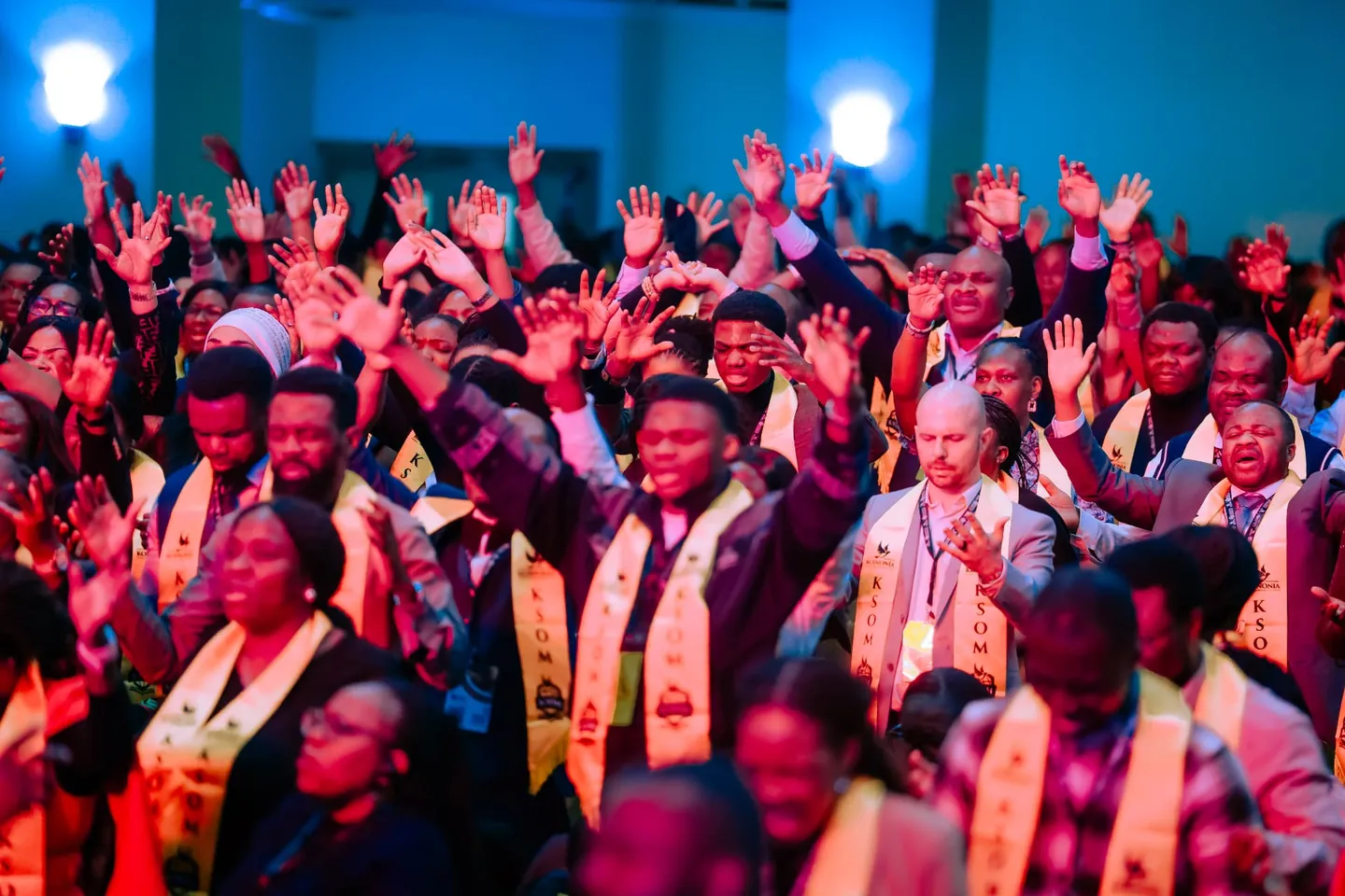KSOM graduates in stoles worshipping together
